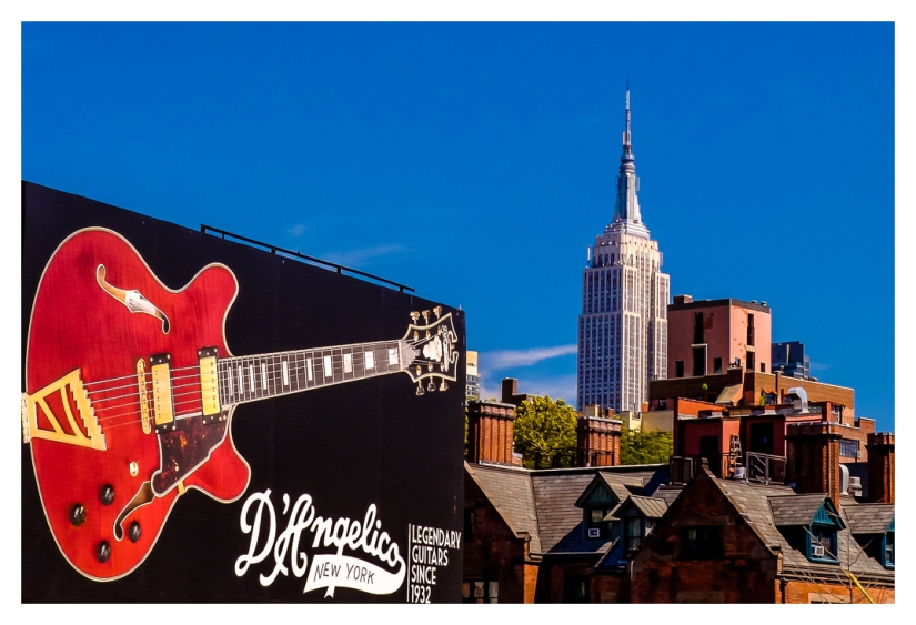 Empire State With Red Guitar Sign